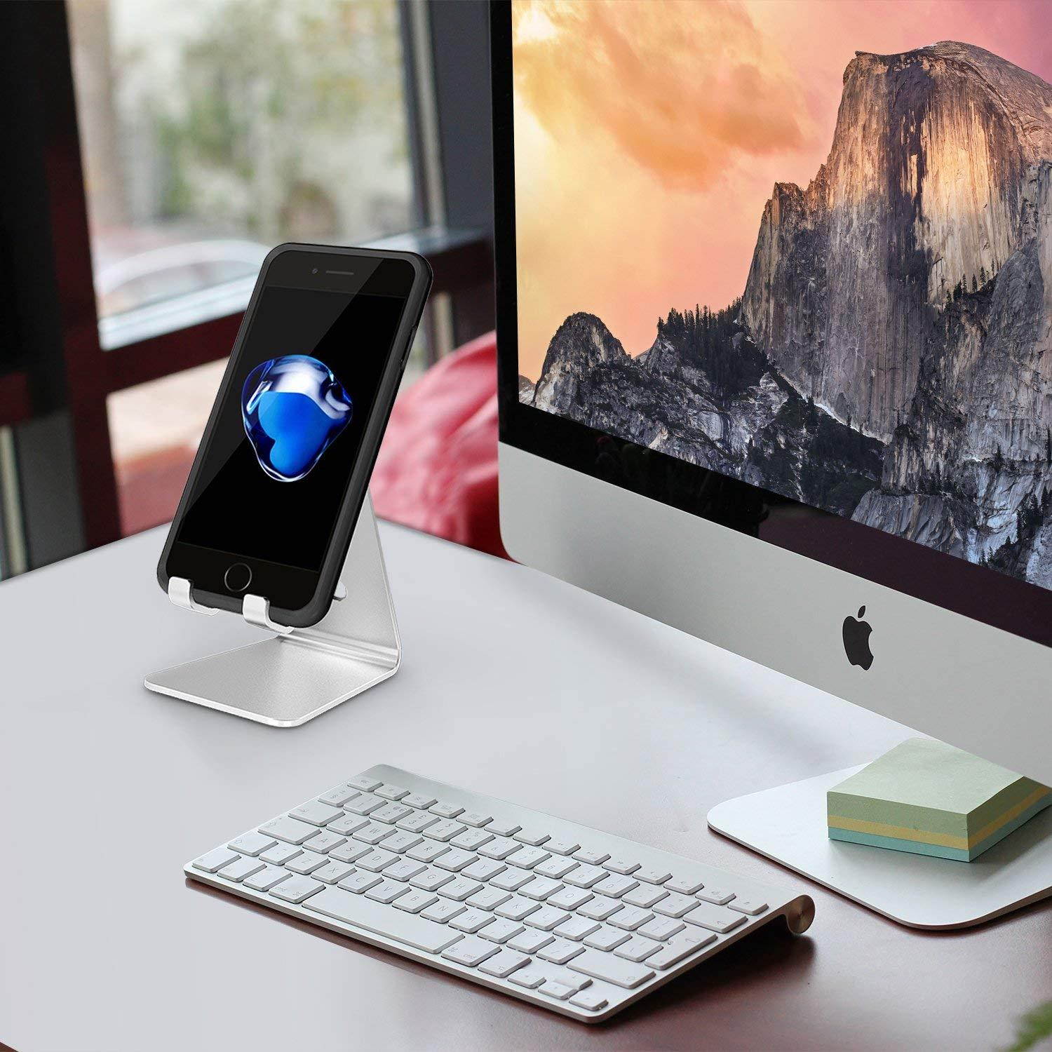 Adjustable Cell Phone Stand, OMOTON Aluminum Desktop Cellphone Stand with Anti-Slip Base and Convenient Charging Port, Fits All Smart Phones, Silver