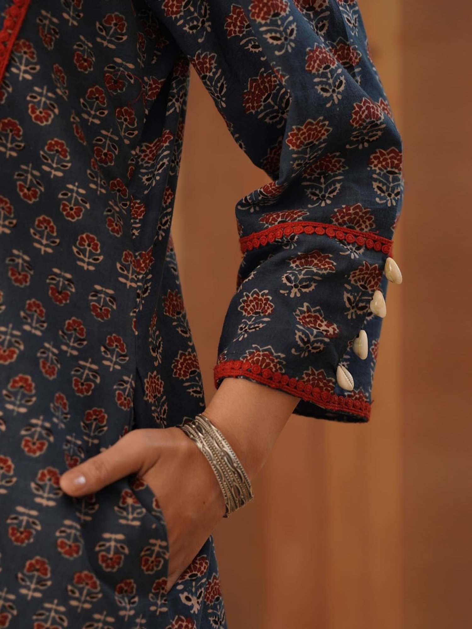 Love Chic Ajrakh Cotton Kurta with cowrie shells and crochet lace details
