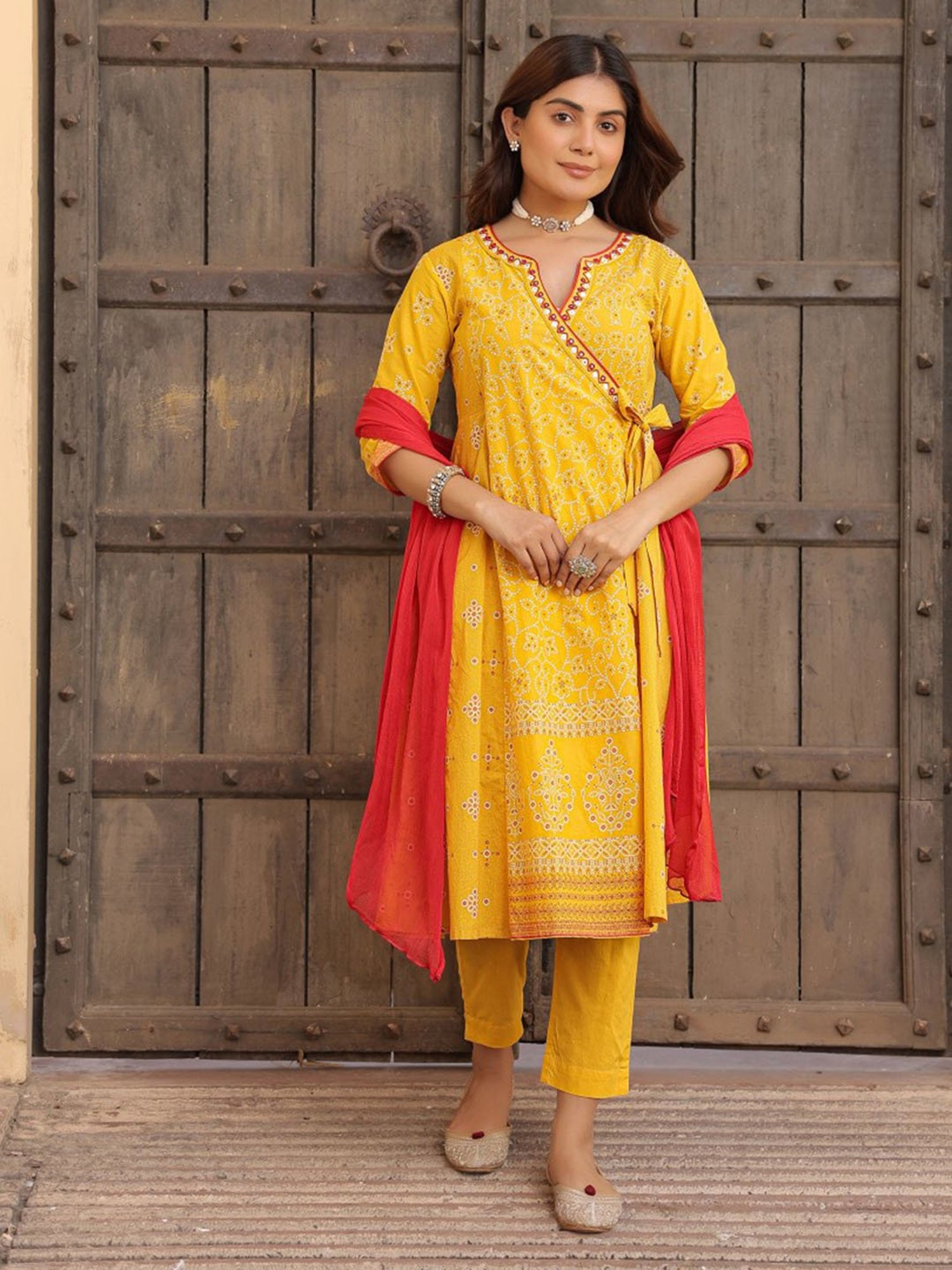 Juniper Mustard Bandhani Print Angrakha Cotton Kurta Pants & Dupatta Set With Mirror Work