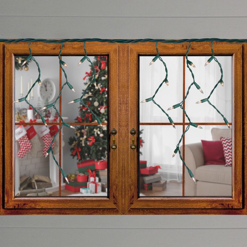 J. Hofert Co Set of 100 Clear Everglow Mini Icicle Christmas Lights - Green Wire