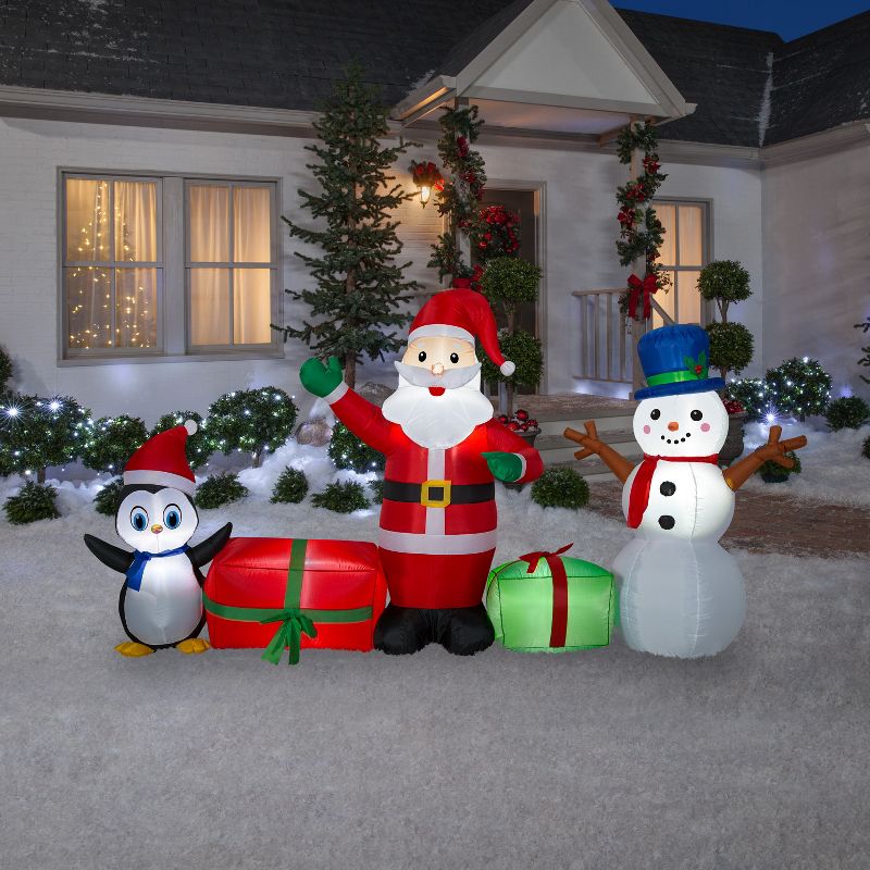 Gemmy Christmas Airblown Inflatable Santa/Snowman/Penguin Collection Scene, 5 ft Tall, Multicolored