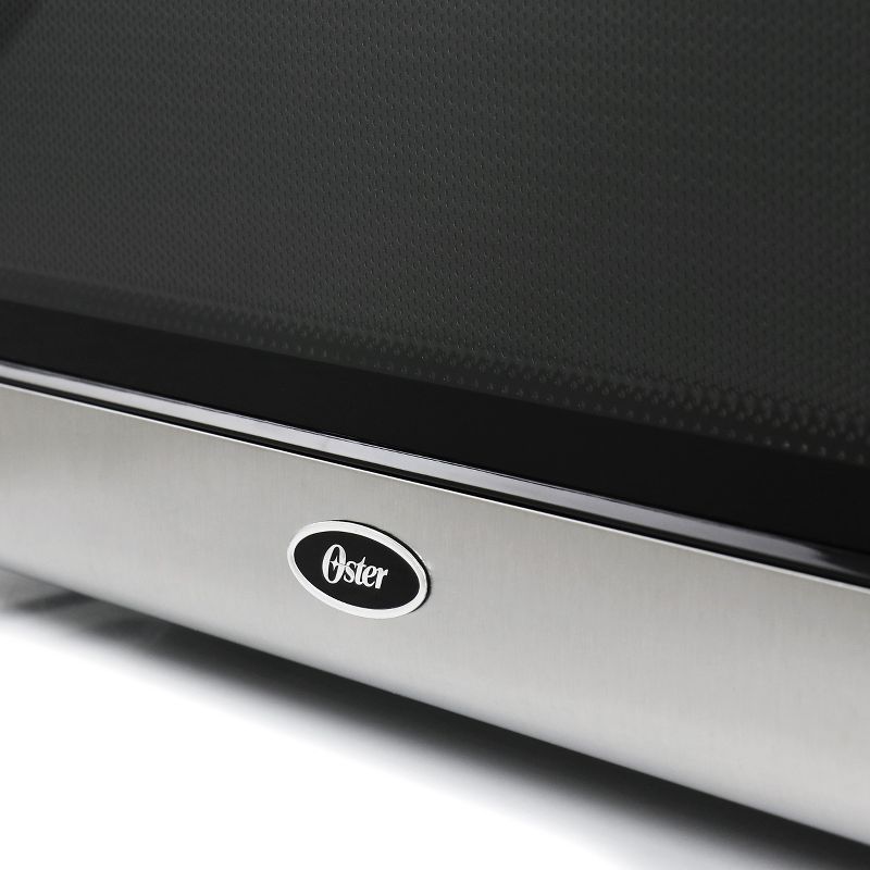 Oster 1.1 CuFt Digital Microwave Oven in Black and Silver
