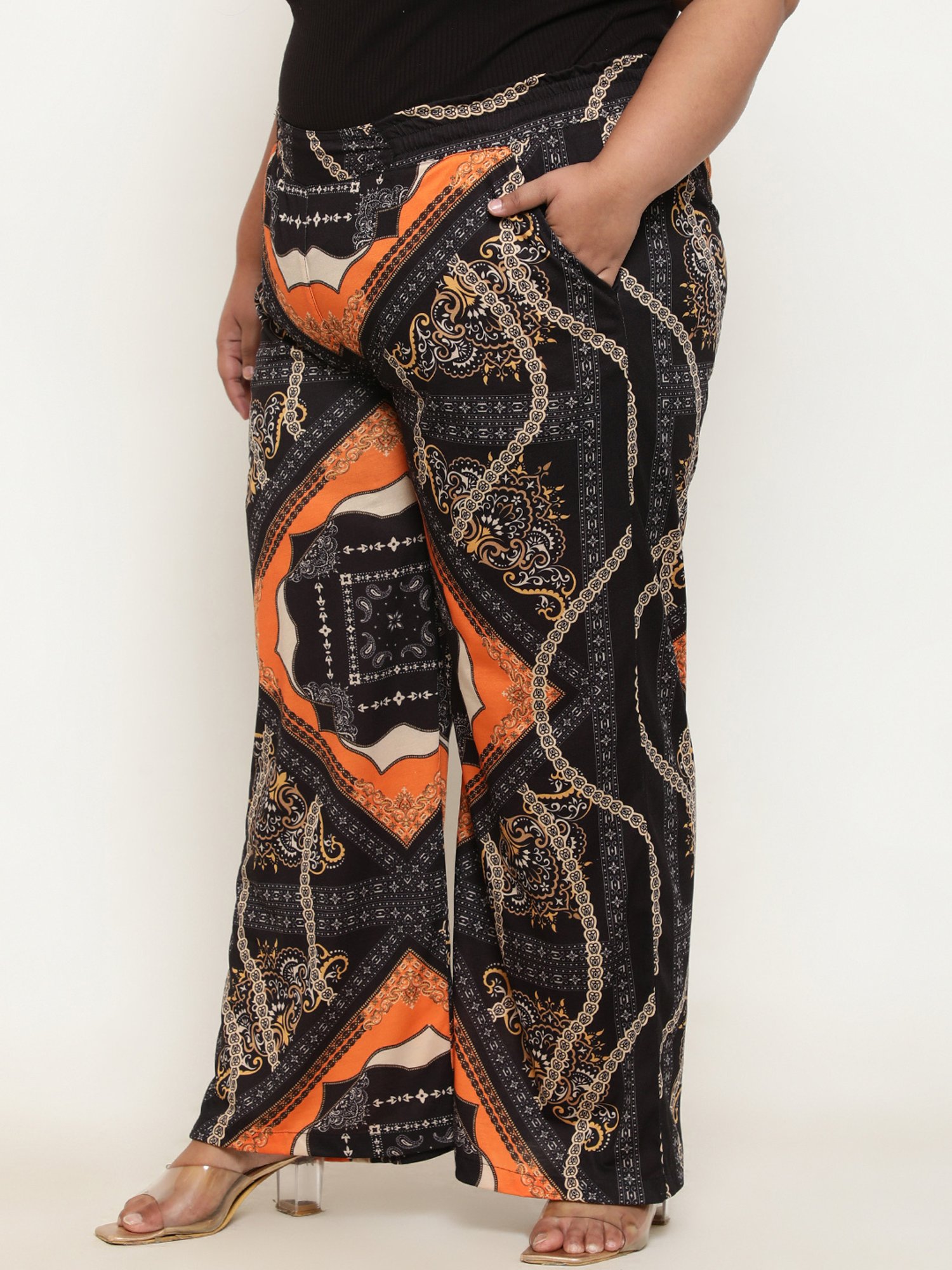 Amydus Black & Orange Printed Flared Fit High Rise Pants