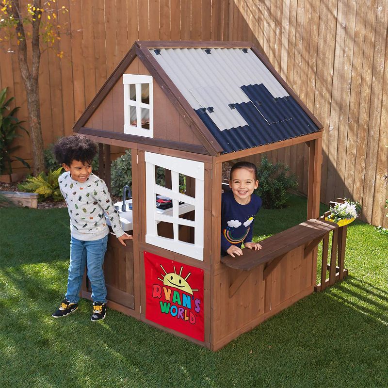 KidKraft Ryan's World Kids Toddlers Outdoor Backyard Playhouse Playset w/ Kitchen and Door, Wood and Plastic Construction, Brown