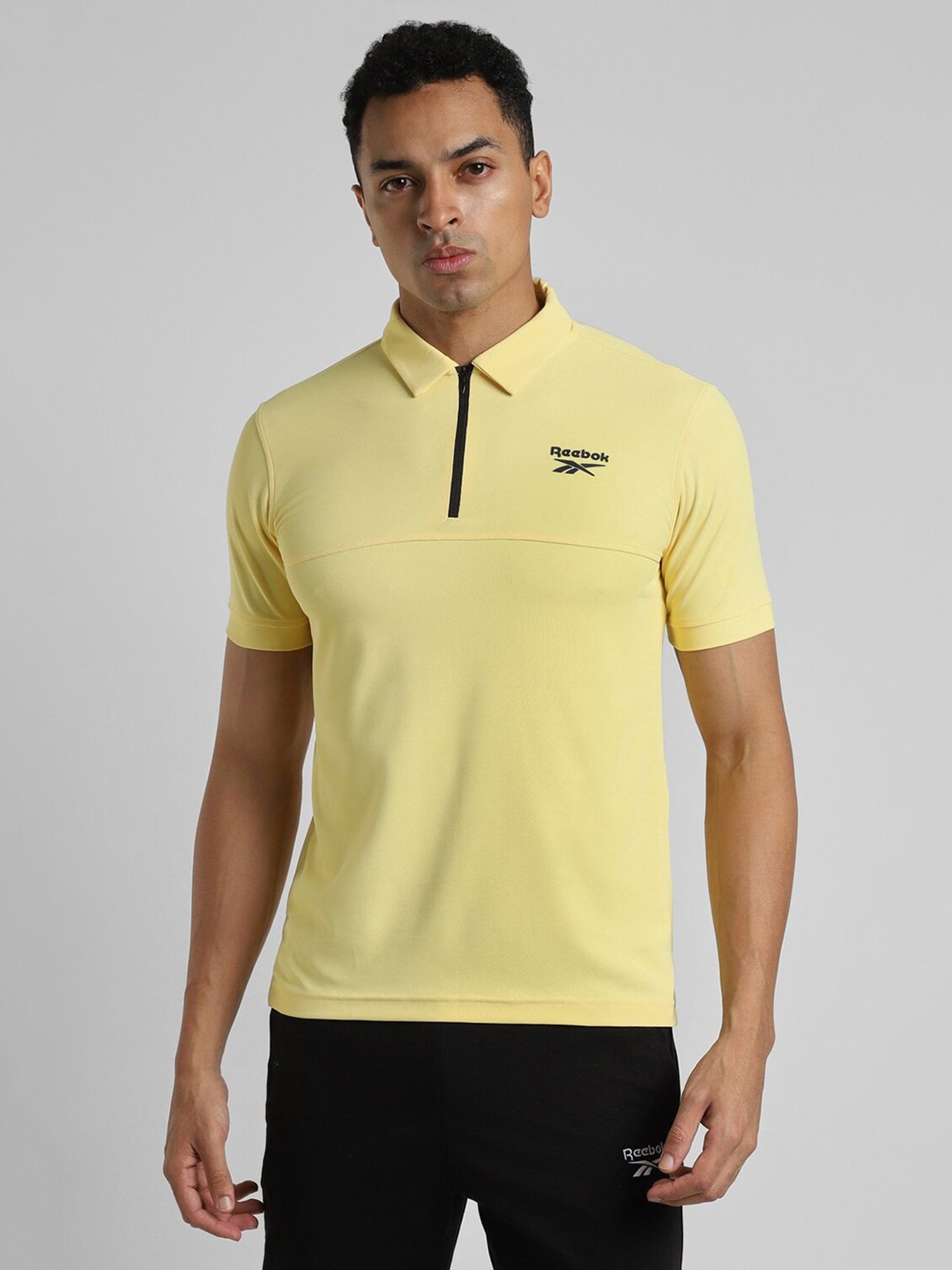 Reebok Yellow Polyester Slim Fit Solid Polo T-Shirt