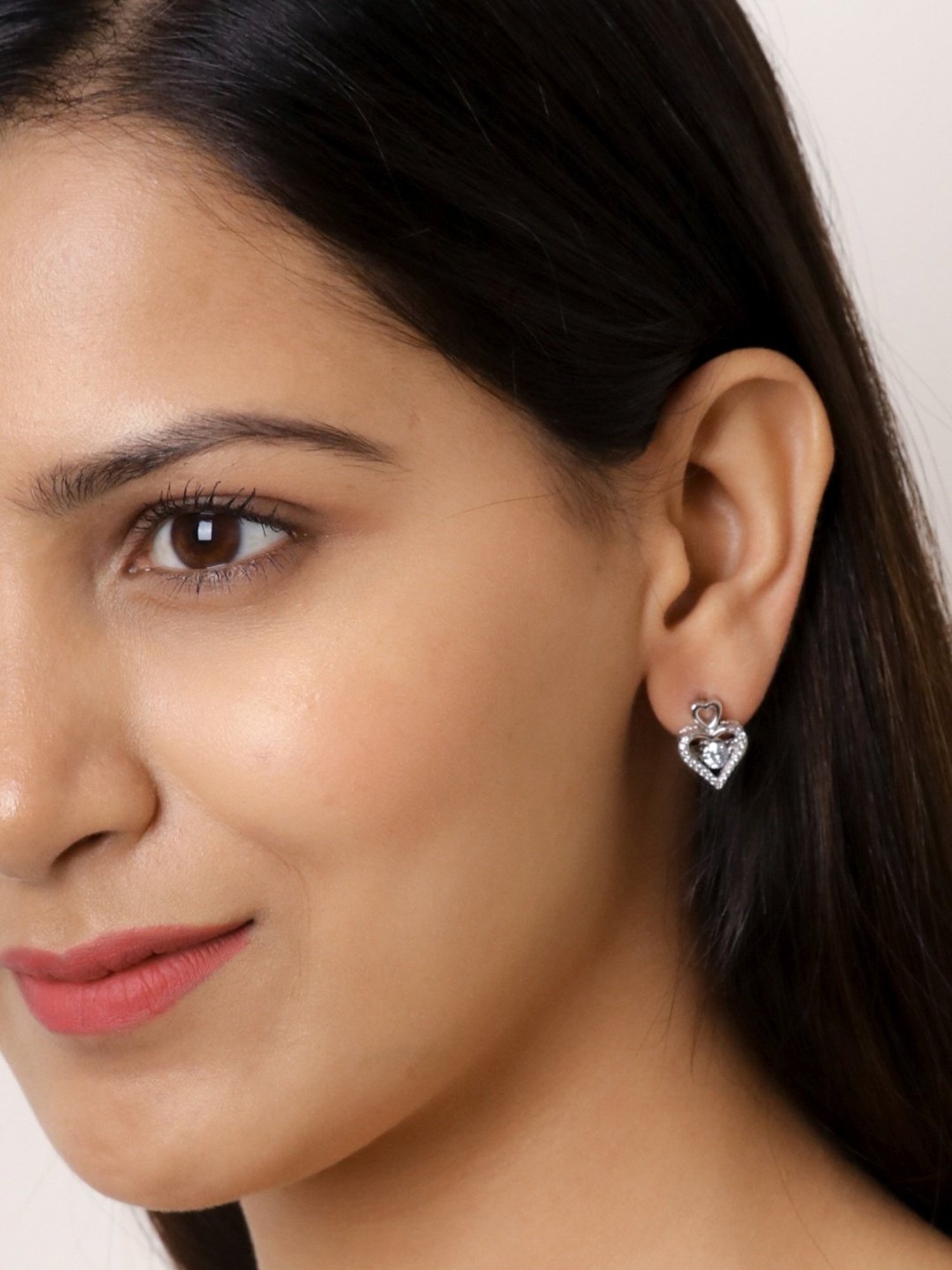 Ornate Jewels 925 Silver Dancing Stone American Diamond Heart Studs Earrings