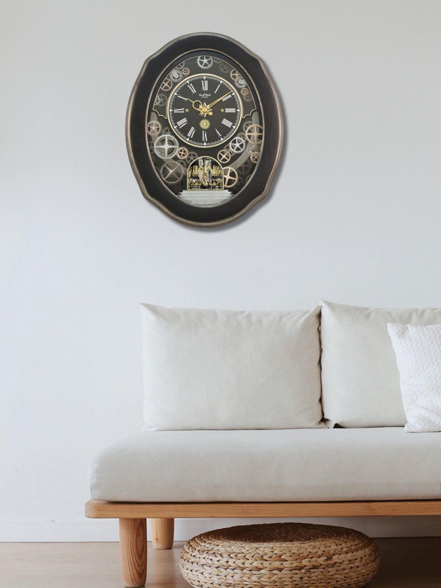 RHYTHM Black Plastic Elegant Oval Shaped Melodies In Motion Wall Clock