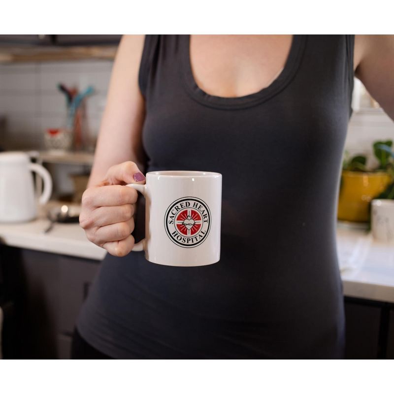 Surreal Entertainment Scrubs Sacred Hearts Hospital Logo Ceramic Mug | Holds 11 Ounces