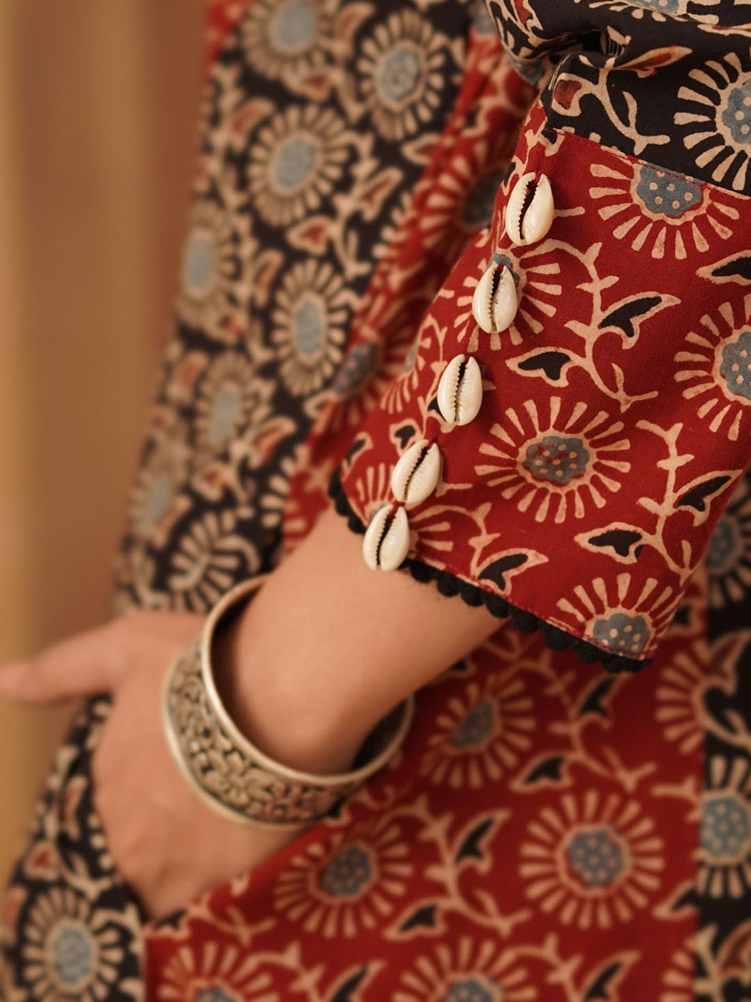 Love Chic Ajrakh Cotton Kurta with cowrie shells and crochet lace details