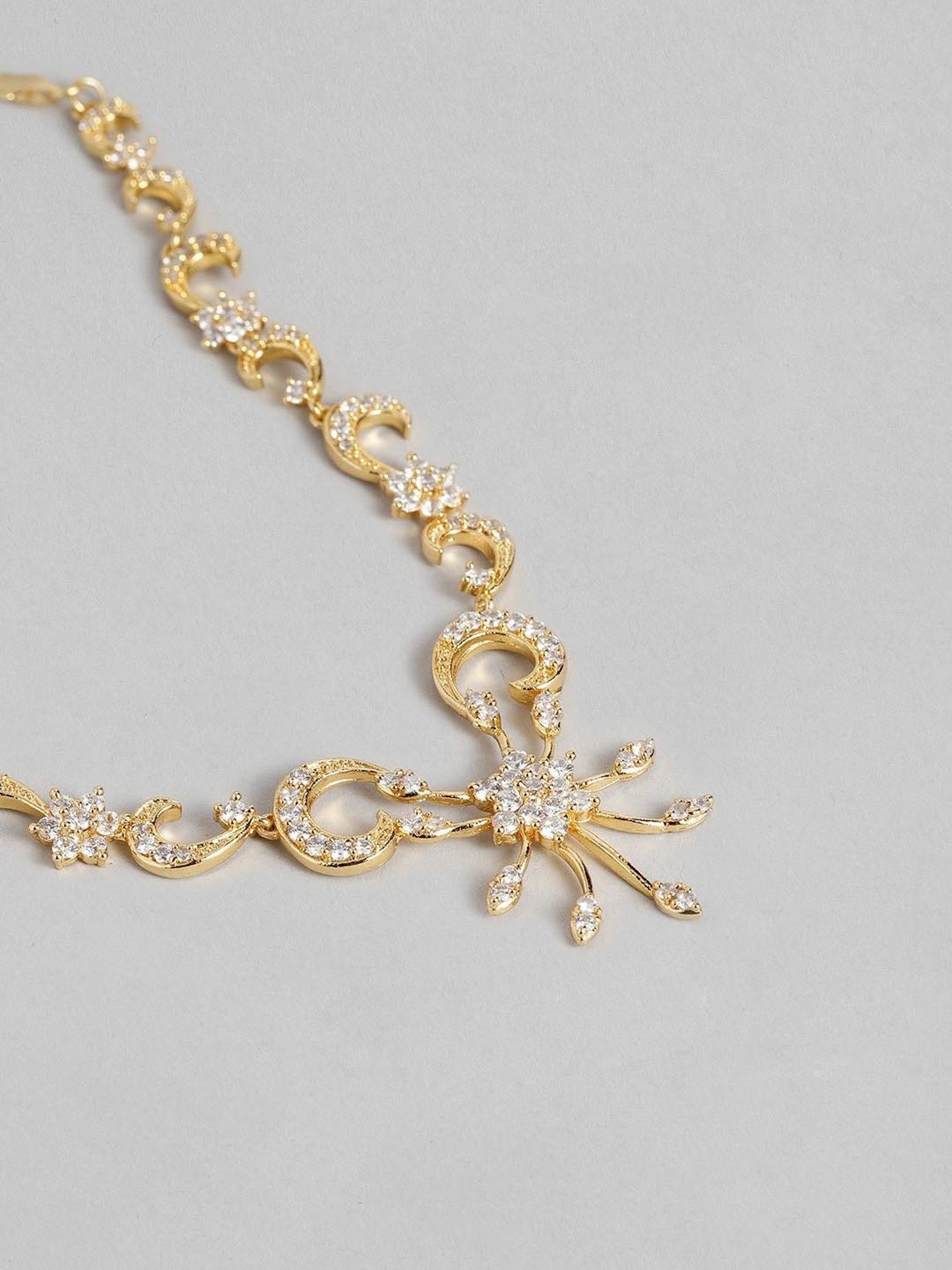 Estele Gold-Plated White CZ Nakshatra Swirl Necklace & Earring Set for Women