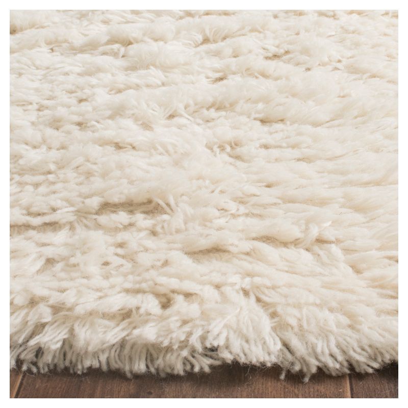 Ivory Solid Knotted Area Rug - (6'x9') - Safavieh