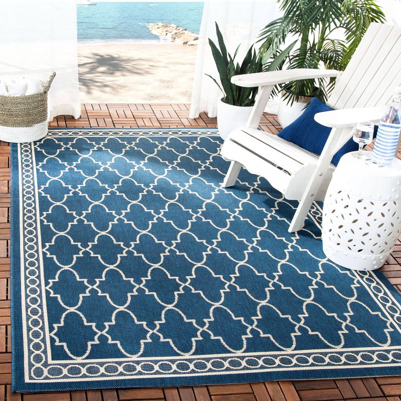 6'7" x 9'6" Gibson Outdoor Rug Navy/Beige - Safavieh