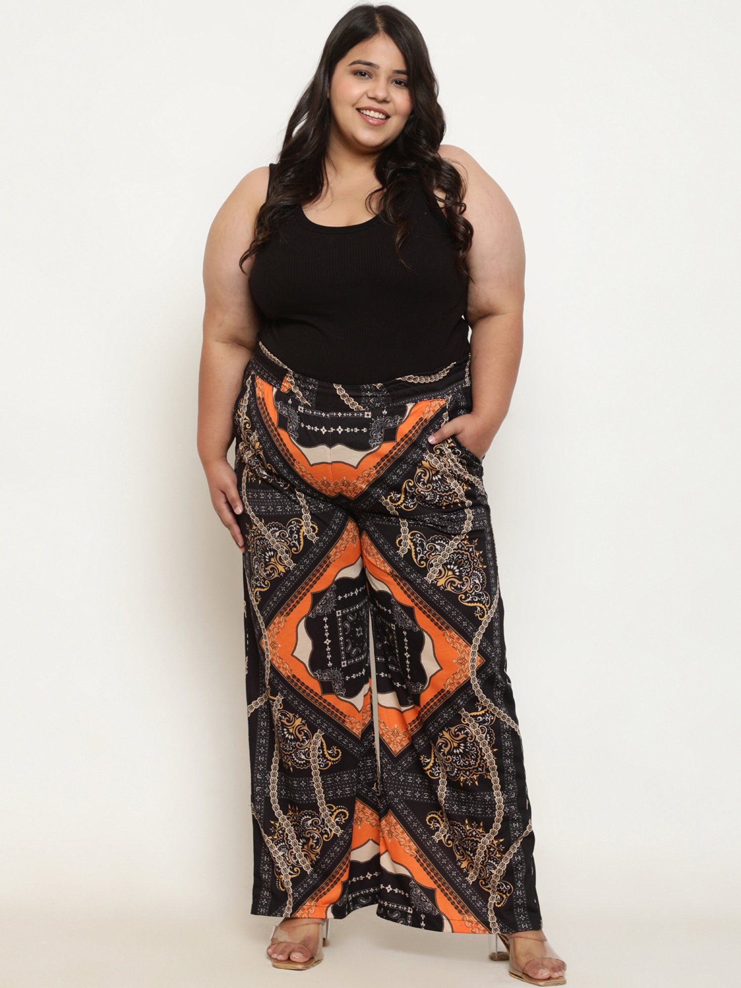 Amydus Black & Orange Printed Flared Fit High Rise Pants