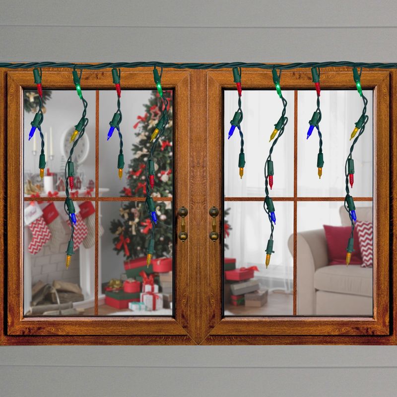 Brite Star Set of 70 Multi-Color LED M5 Icicle Christmas Lights - 10ft Green Wire