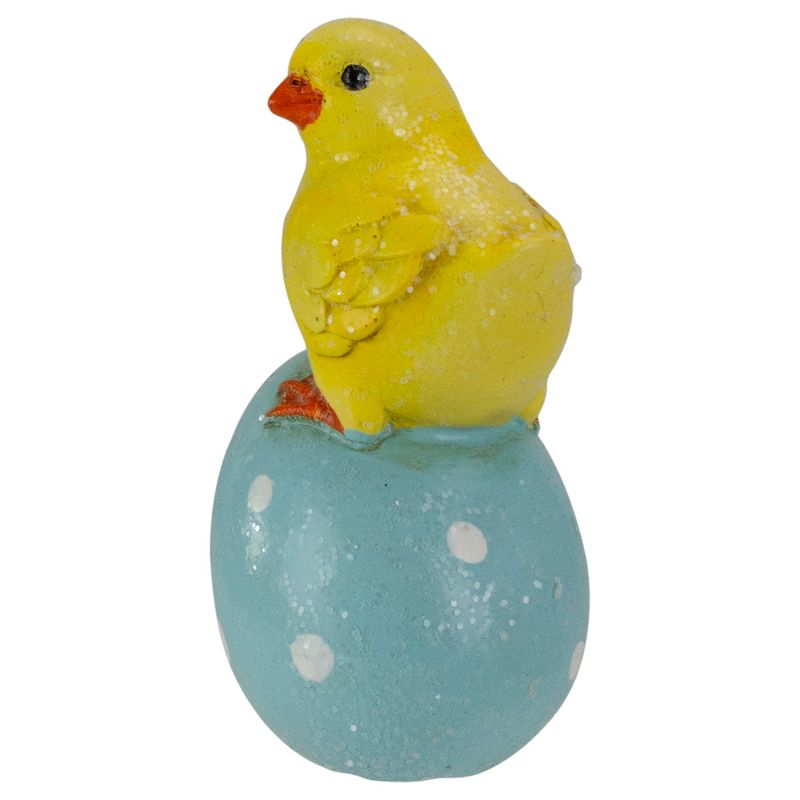 Darice 4" Yellow Chick Perched on a Blue Easter Egg Tabletop Decor