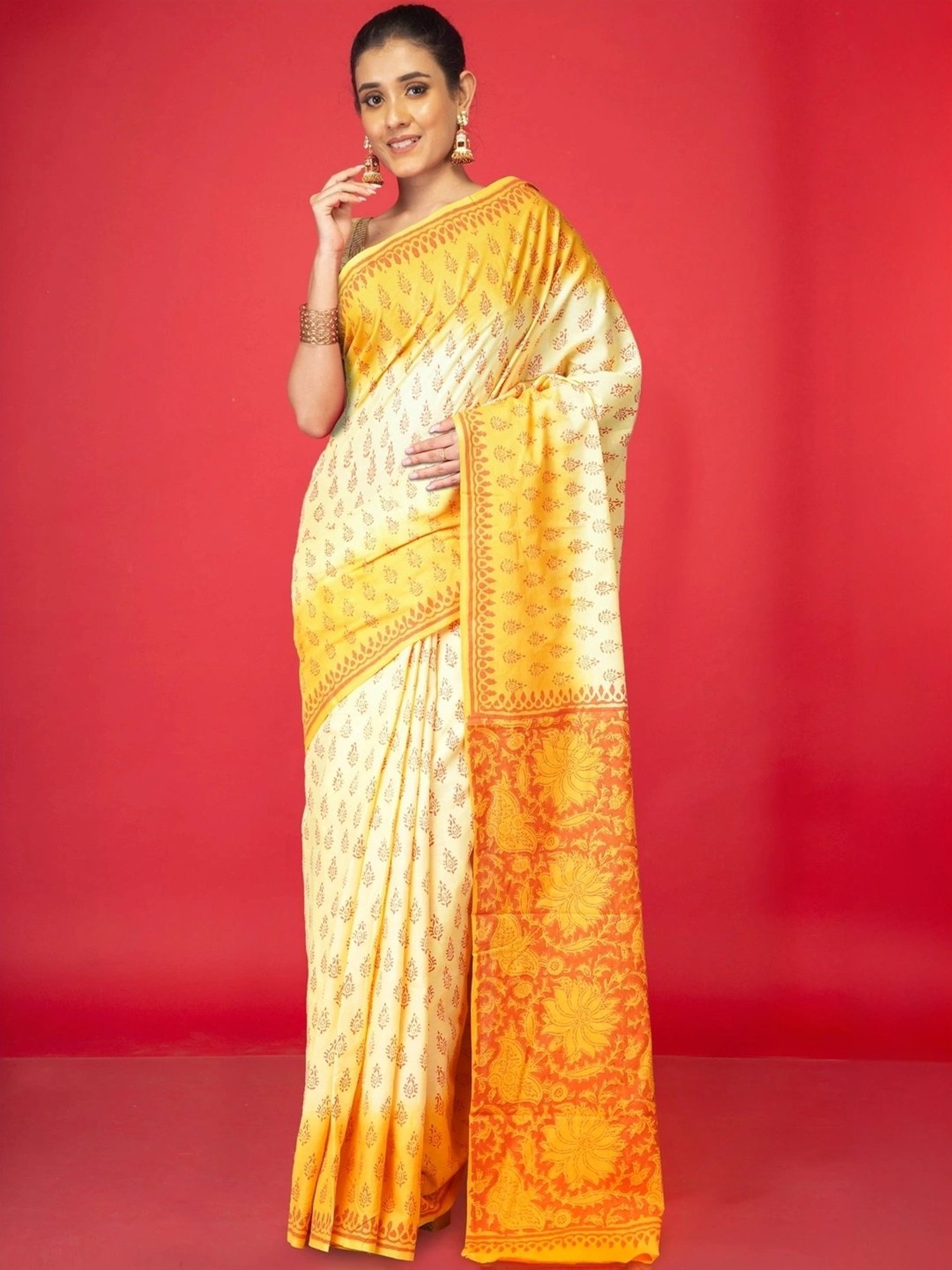 Unnati Silks Cream & Orange Cotton Printed Saree With Unstitched Blouse