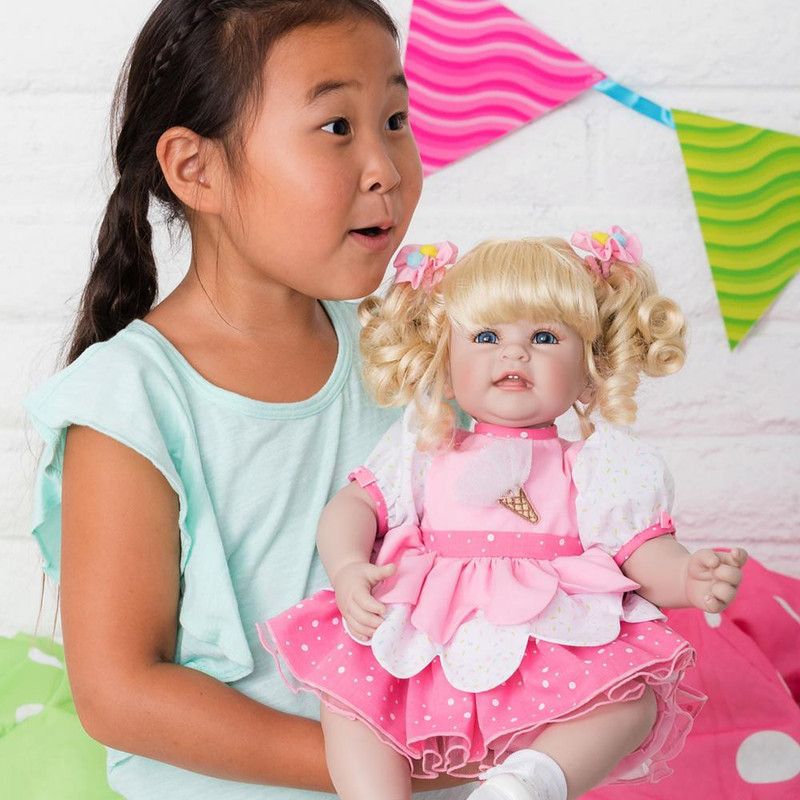 Adora Toddler Doll Ice Cream Party with layered petal party dress and pom pom hair accessories