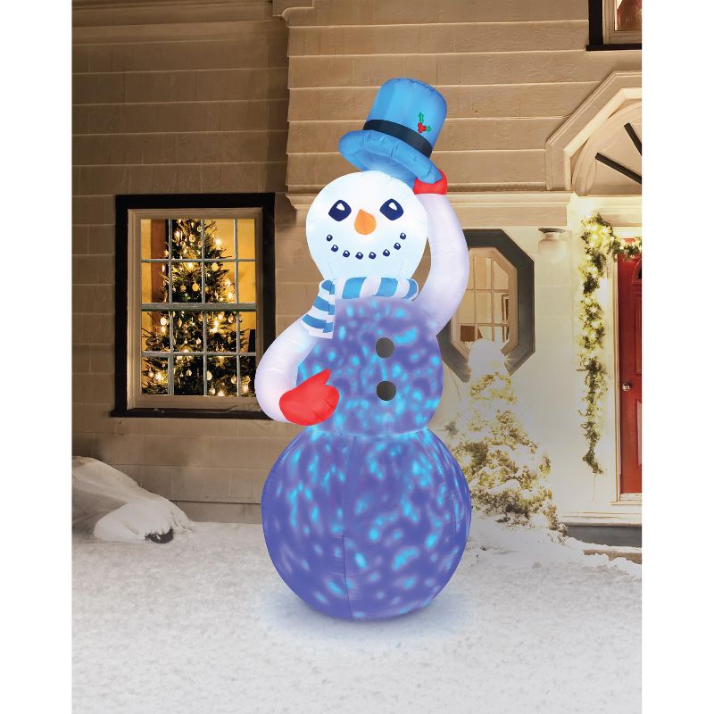 Occasions 7' Inflatable Swirling Lights Snowman With Tipping Hat, 7 ft Tall, Multicolored