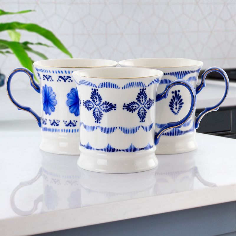 Meritage Navy 12 Piece 13.2 Ounce Fine Ceramic Cup Set in White with 4 Assorted Designs