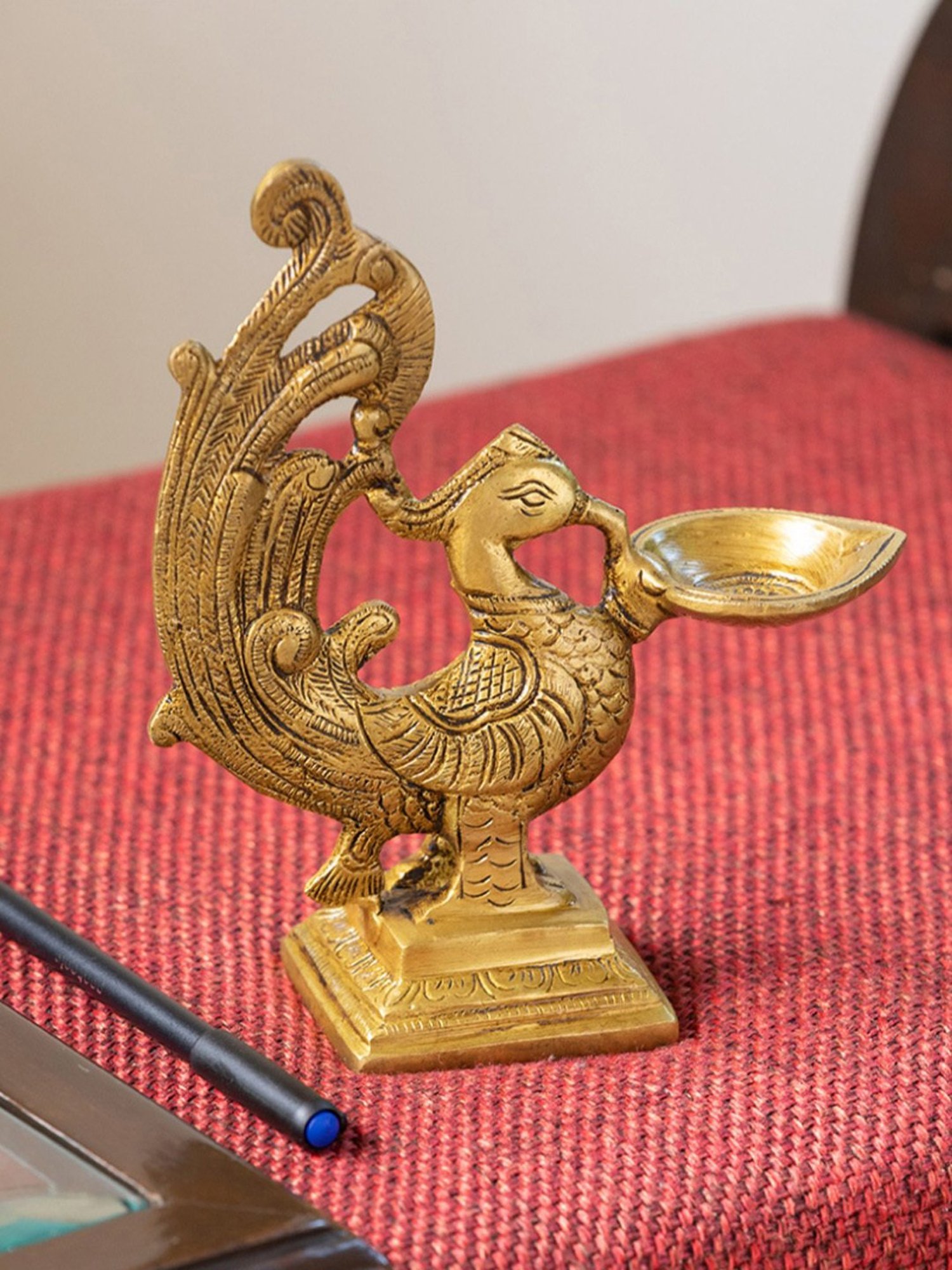 ExclusiveLane Gold Brass Marvellous Peacock Hand-Etched Carved Diya