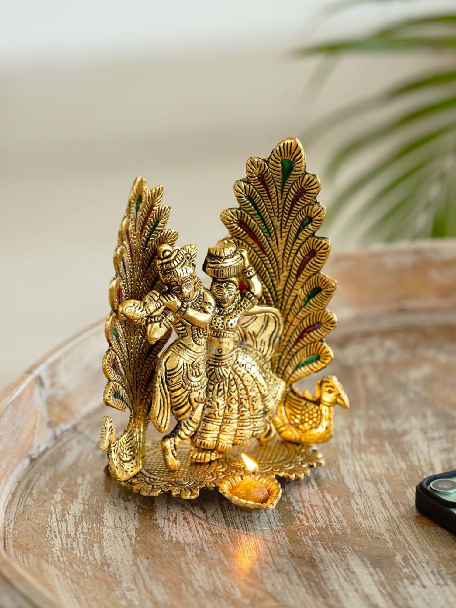 ExclusiveLane Golden Aluminium Radha-Krishna & Peacock Idol With Diya