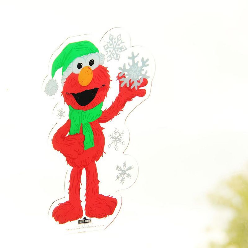Northlight 6.5" Red and Green Sesame Street Elmo with Snowflakes Jelz Christmas Window Cling