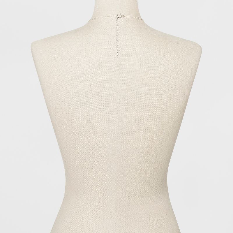 Caged Cubic Zirconia, A Smooth Bar & A Tassel Three Pendant Long Necklace - A New Day™ Silver