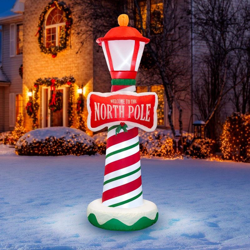 Holidayana 6 Foot Tall Giant Inflatable North Pole Lamp Post Holiday Ornament Yard Decoration with Blower Fan, Tie Down Straps, & Ground Anchor Stakes