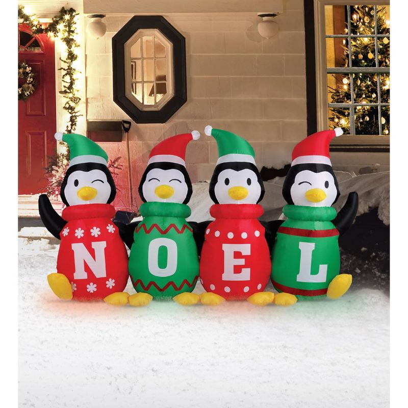 Occasions 6' Inflatable Sweater Penguins, 3.5 ft Tall, Multicolored