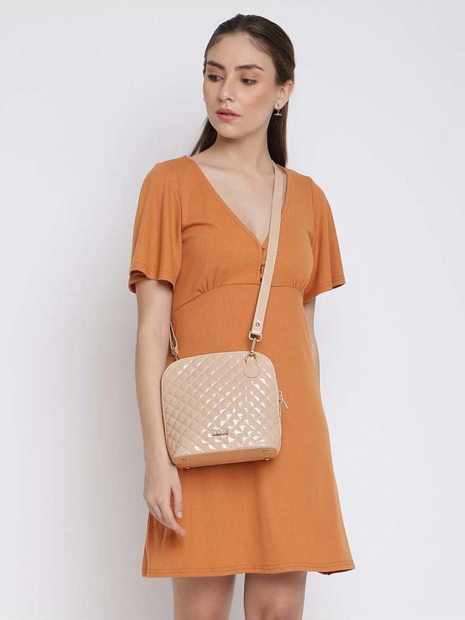 KLEIO Cream Rivets Medium Sling Handbag