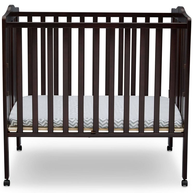Delta Children Folding Portable Mini Baby Crib with 1.5'' Mattress, Greenguard Gold Certified - Dark Chocolate