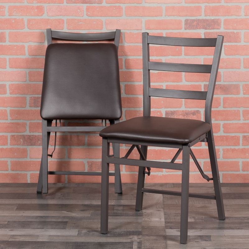 Emma and Oliver Brown Folding Ladder Back Metal Chair with Brown Vinyl Seat
