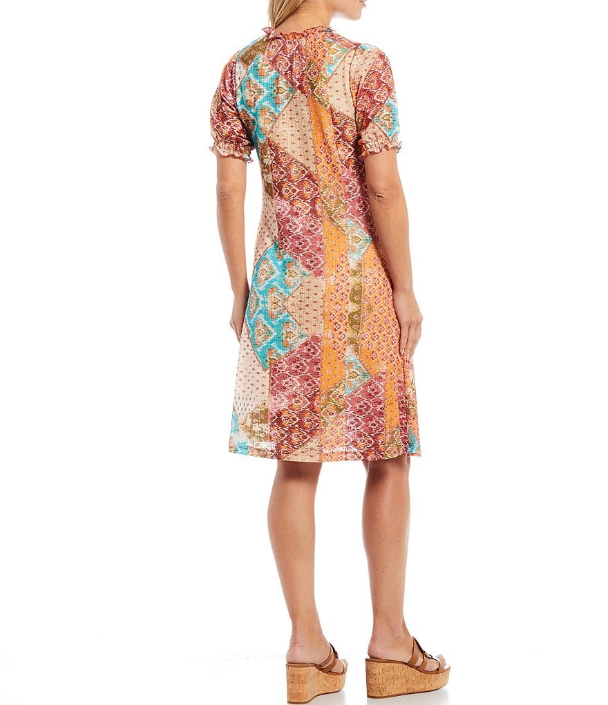 Reba Patchwork Print Jewel Tie V-Neck Ruffle Hem Tassel Detail Short Sleeve Pocket Knit Dress