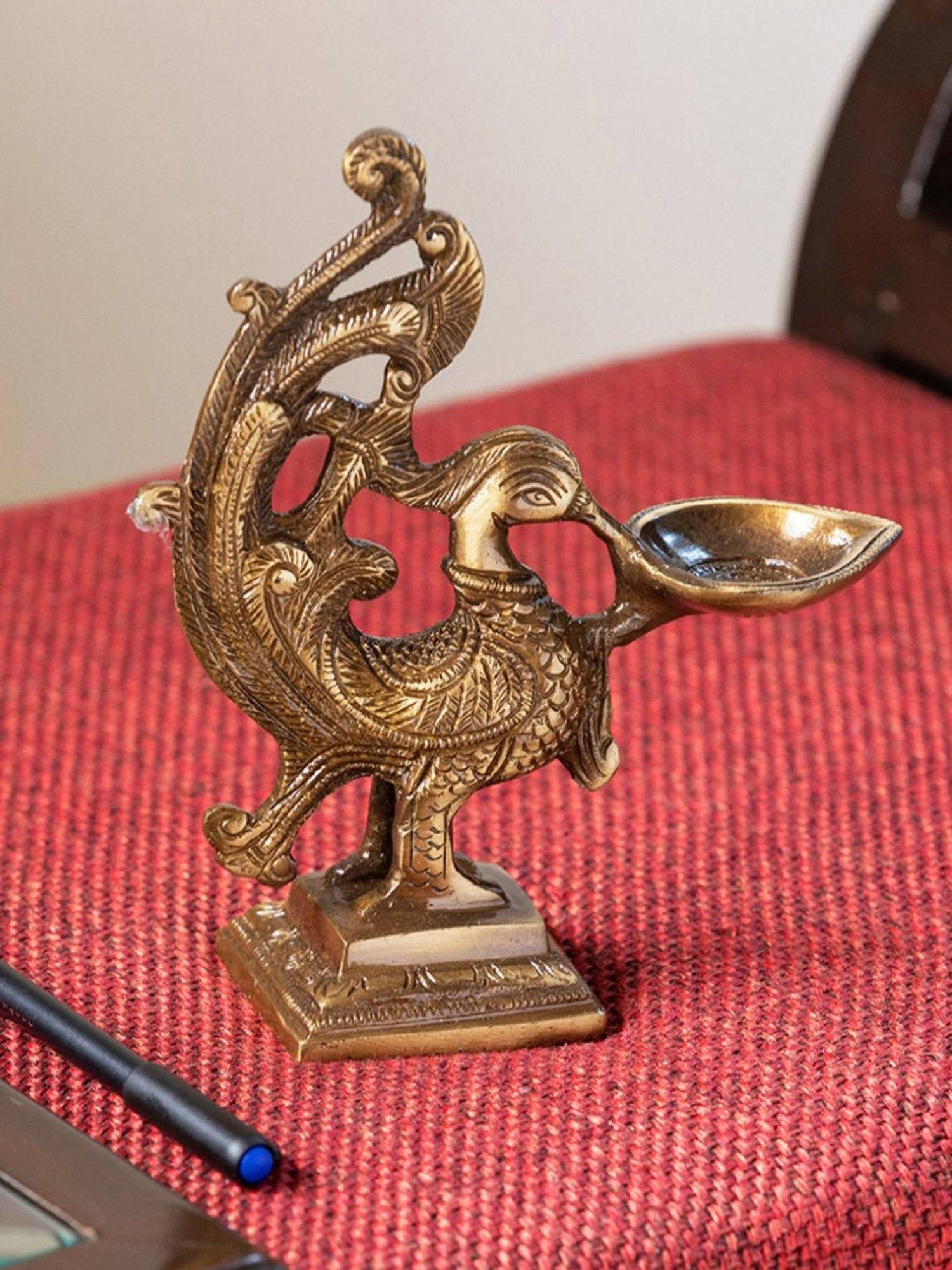 ExclusiveLane Gold Brass Princely Peacock Hand-Etched Carved Diya