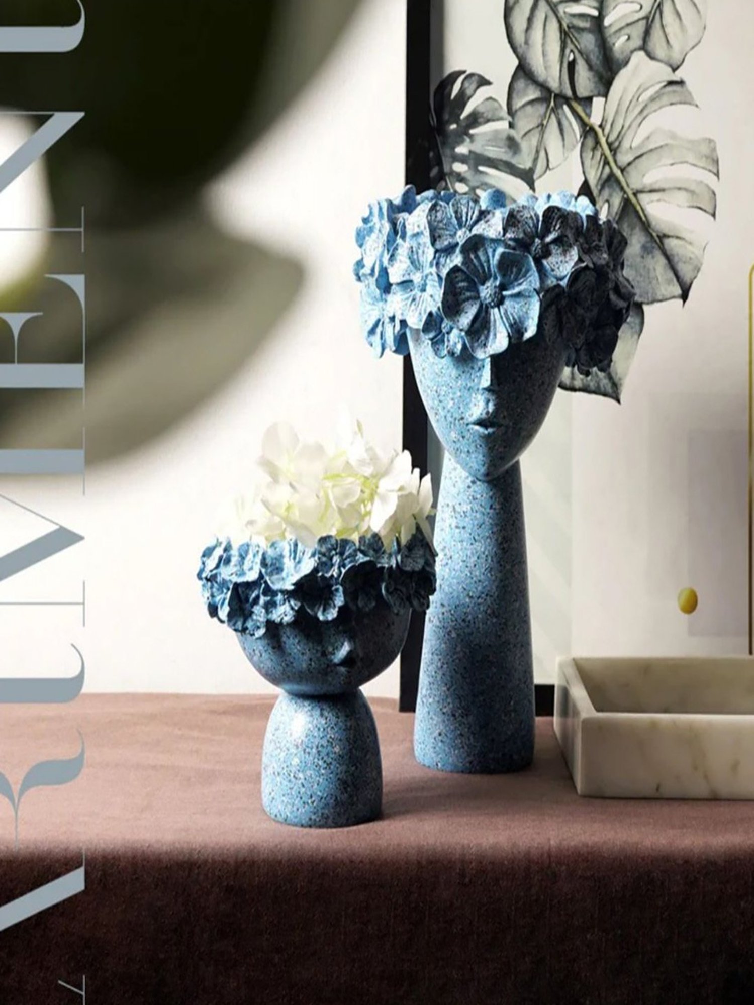 The Artment Blue Resin Surreal Faces Table Planter