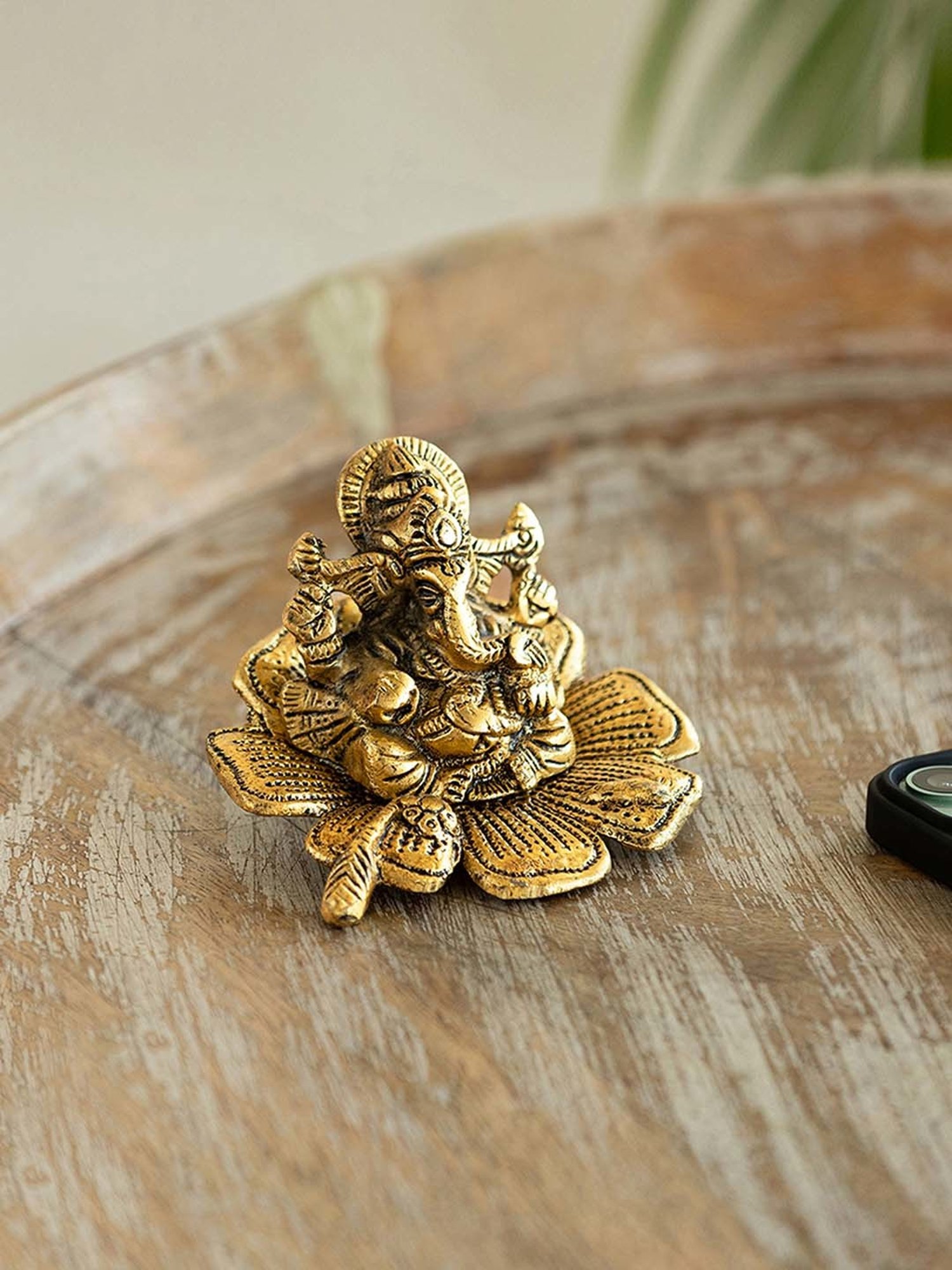 ExclusiveLane Golden Aluminium Ganesha On Flower Decorative Idol