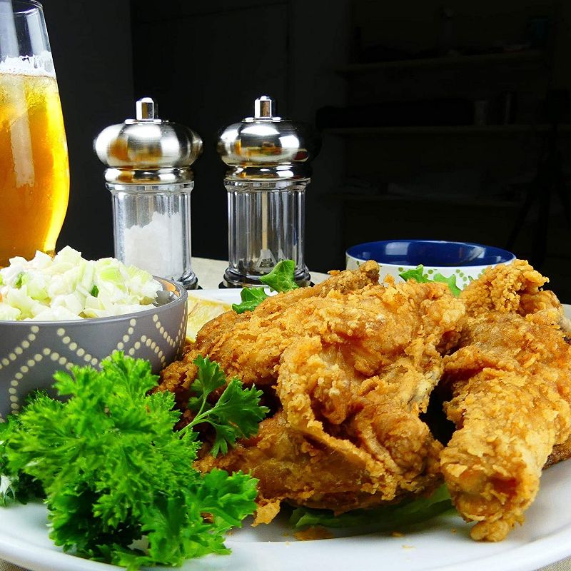 Bayou Classic 14 Quart Seasoned Cast Iron Dutch Oven Camping Cooking Pot with Aluminum Steamer Fry Basket and Raised Lip Lid, Black