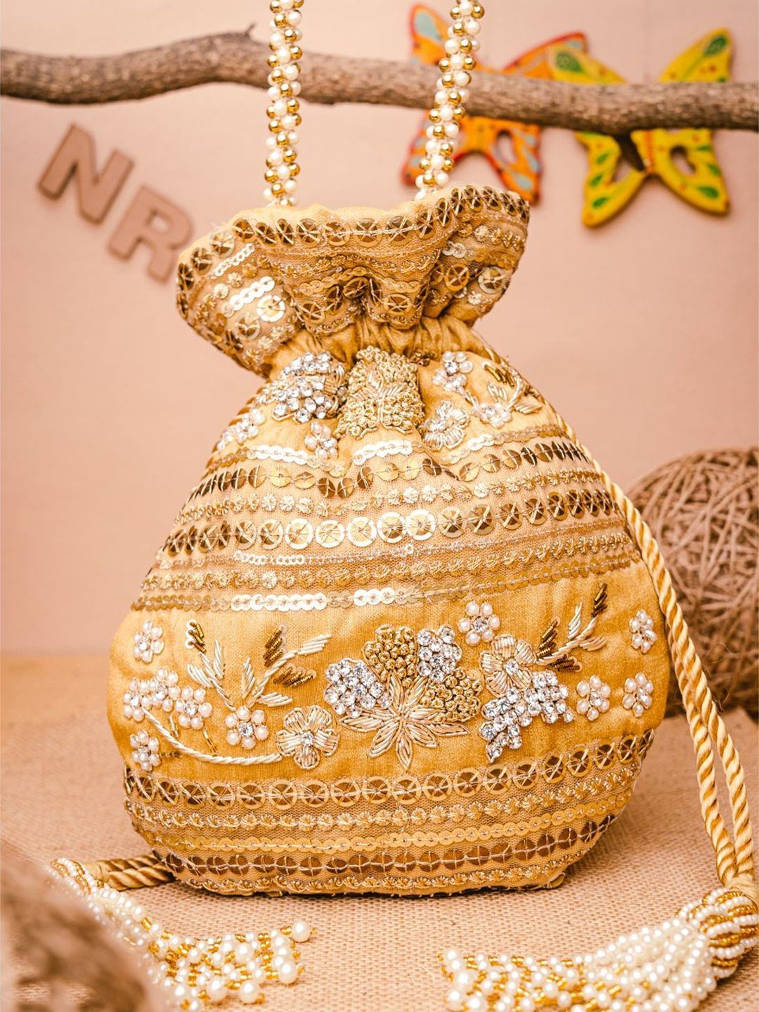 NR by Nidhi Rathi Golden Embellished Potli