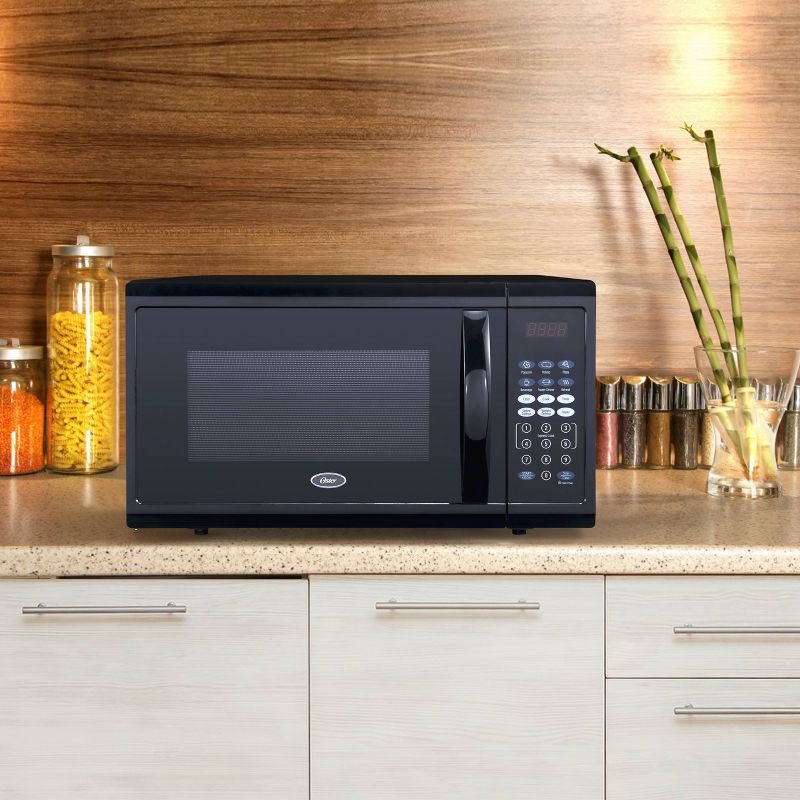Oster 1.1 cu ft 1100W Digital Microwave Oven - Black OGZJ1104
