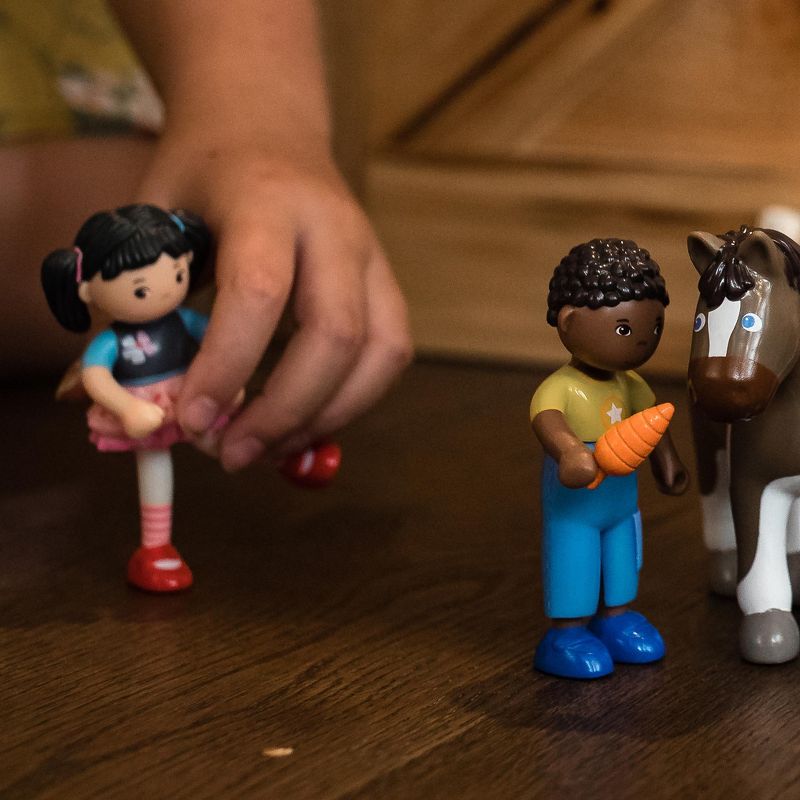 HABA Little Friends Lara - 4" Bendy Doll Figure with Black Pigtails