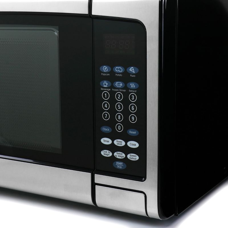 Oster 1.1 CuFt Digital Microwave Oven in Black and Silver