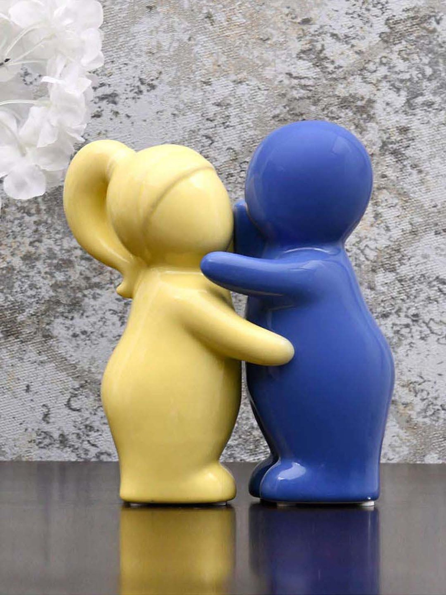 @home Yellow & Blue Resin Two Children Hugging Decorative Showpiece - Set of 2