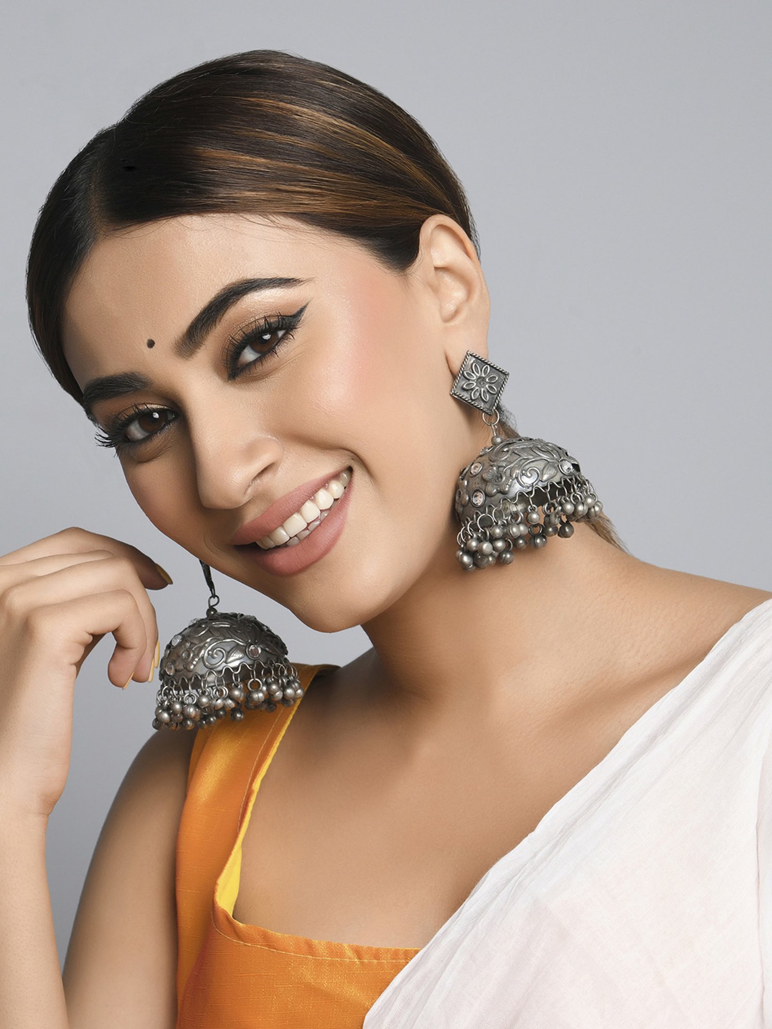 Fida Embossed Dome Shaped Silver Jhumki Earrings