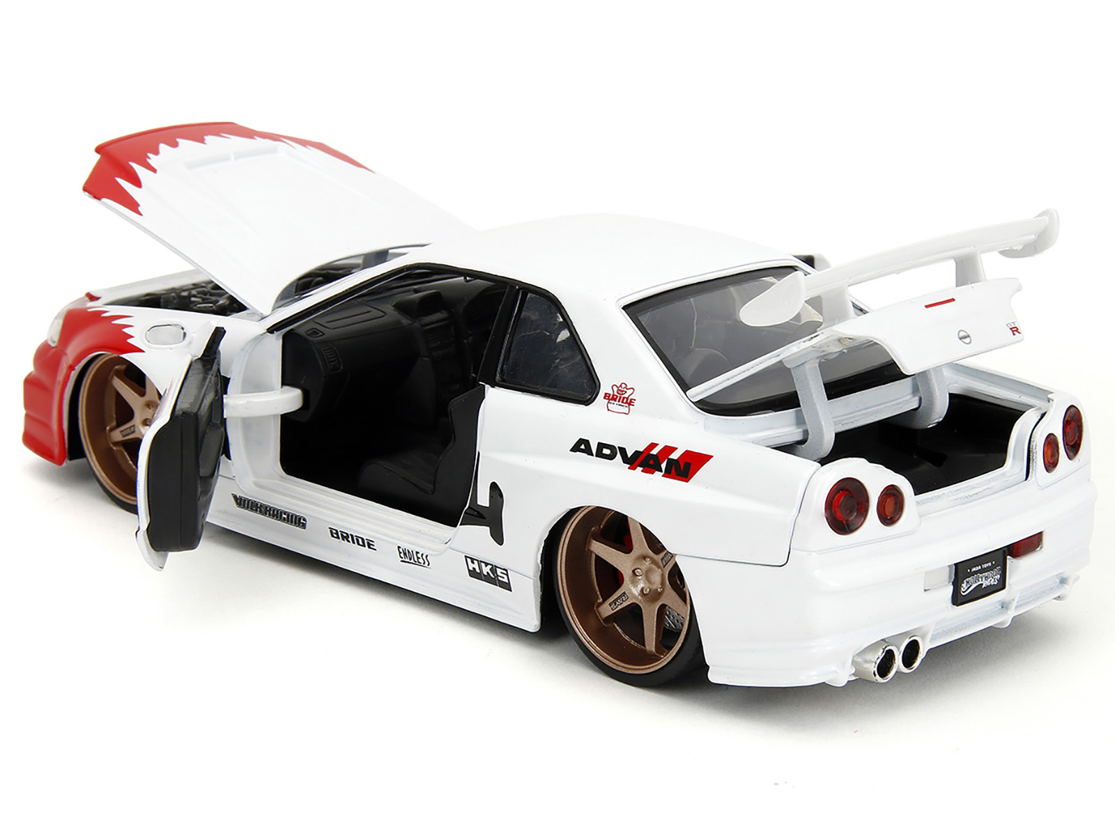 2002 Nissan Skyline GT-R (R34) RHD (Right Hand Drive) White with Red Graphics and Ryu Diecast Figure "Street Fighter" Video Game "Anime Hollywood Rides" Series 1/24 Diecast Model Car by Jada