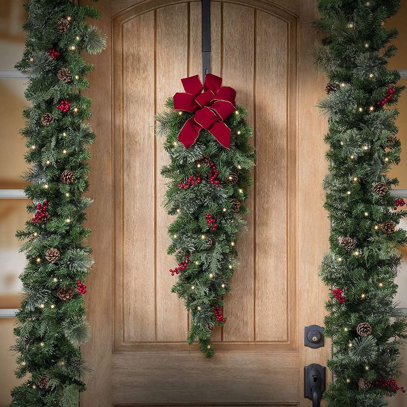 Haute Decor Classic 3 Foot Pre-lit Christmas Swag Garland with 30 LED Lights, Red Bow, Greenery Tips, Faux Berries, and Real Pinecones, Warm White