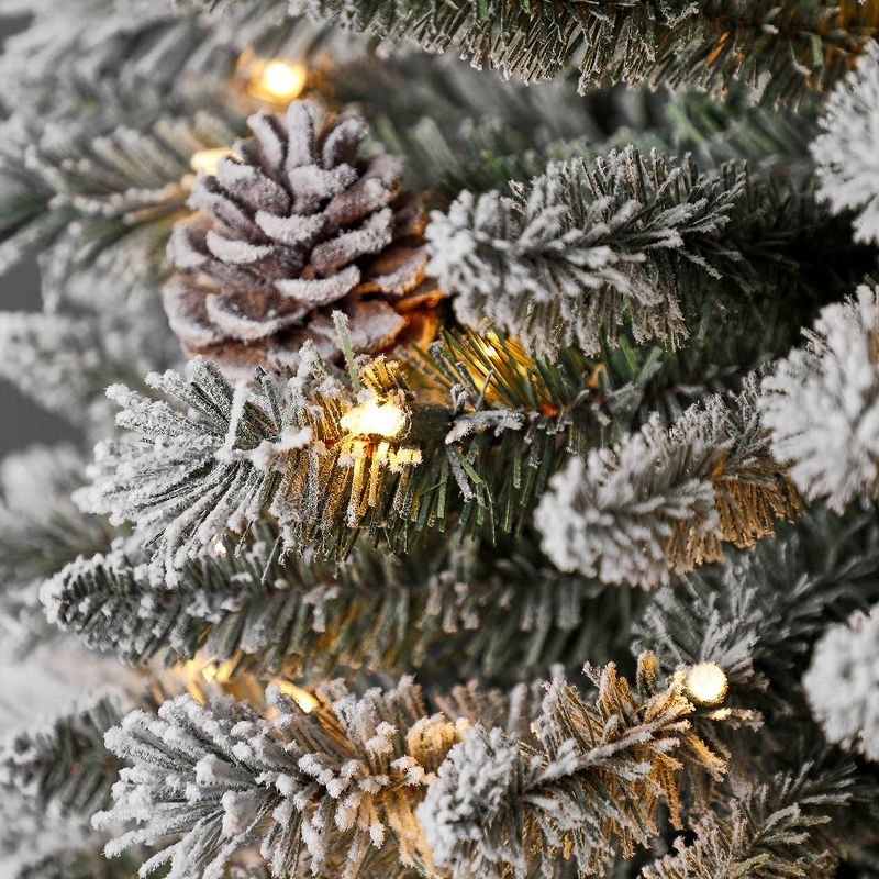 Home Heritage 9 Foot Lowell Snow Flocked Pencil Pine Prelit Decorative Artificial Christmas Tree with Pinecones, Clear White Lights, and Metal Stand