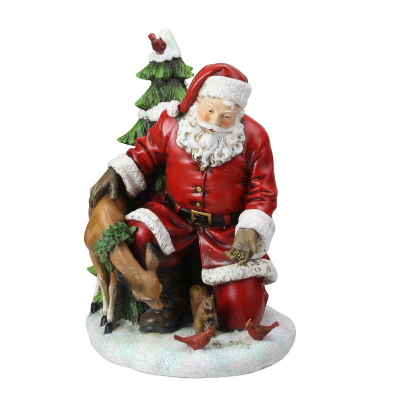 Napco 11.5" Red and White Santa Claus Feeding The Animals Christmas Table Figurine
