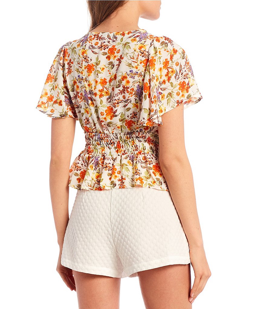 Evolutionary Flutter Sleeve Disty Print Smocked Top