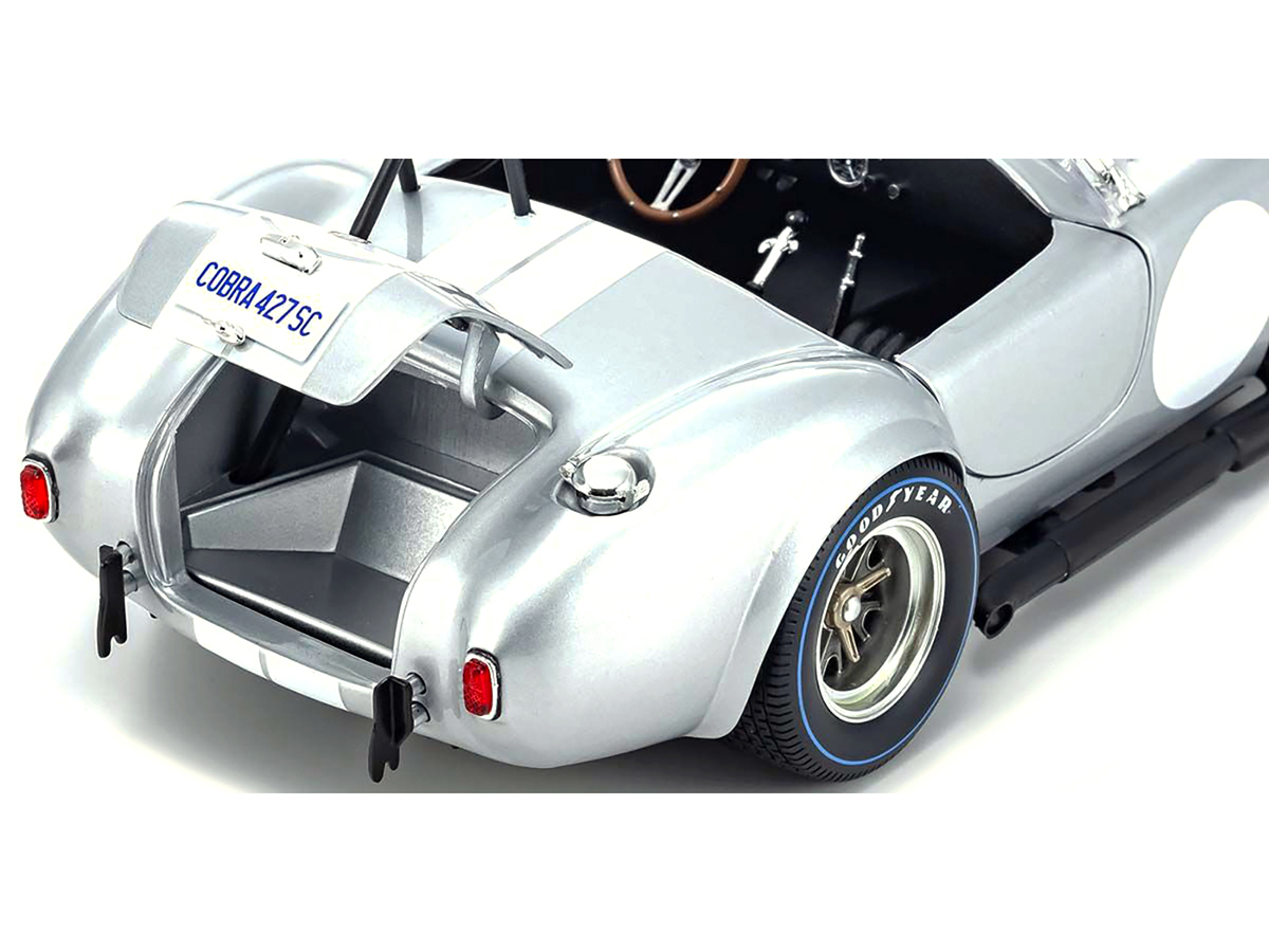 1965 Shelby Cobra 427 S/C Dark Blue Metallic with White Stripes with Printed Carroll Shelby's Signature on the Trunk 1/18 Diecast Model Car by Shelby Collectibles