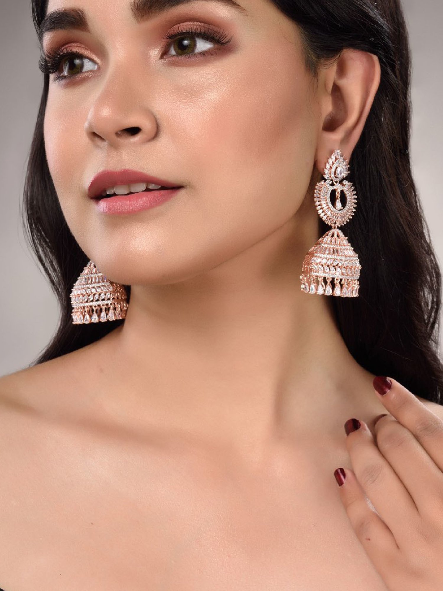 Saraf RS Jewellery Rose Gold White AD Studded Jhumka Earrings